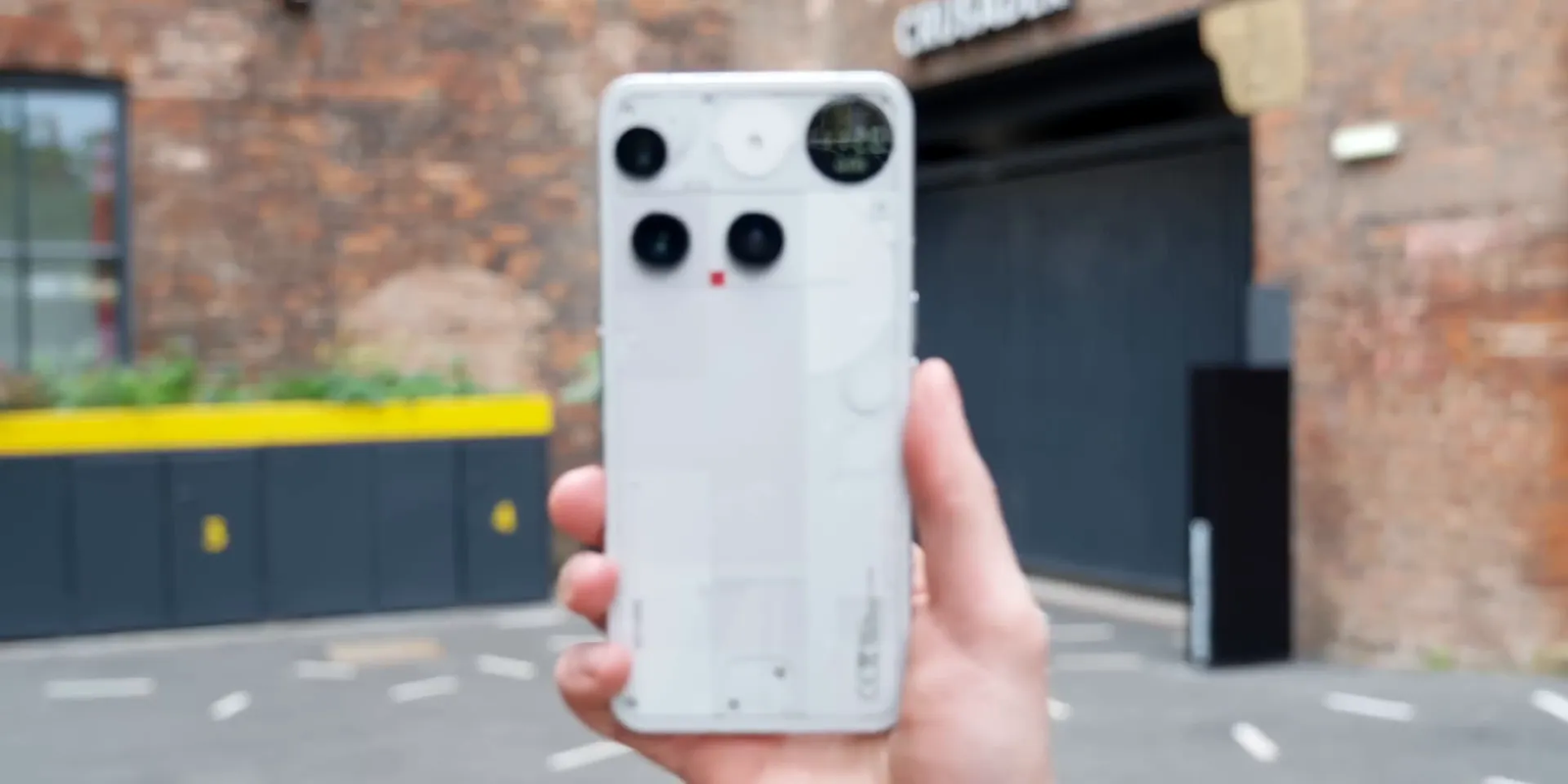 Nothing Phone 3 in hand showcasing its unique transparent and blocky design