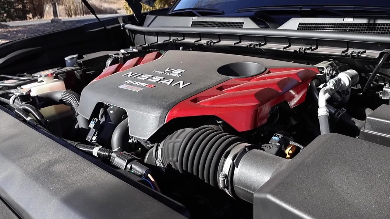 2026 Nissan Armada Nismo 3.5L twin-turbo V6 engine bay with red-accented cover and intake