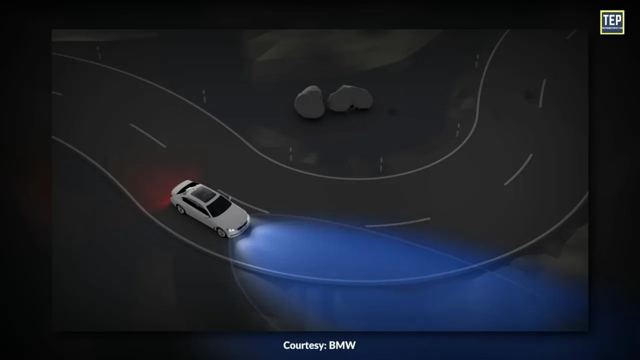 Animation showing headlight beams sweeping around a curved road